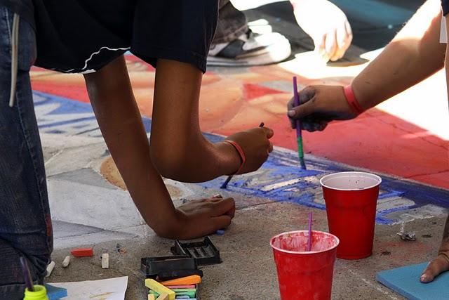 DATA  students work hard to perfect their mural before it is judged.