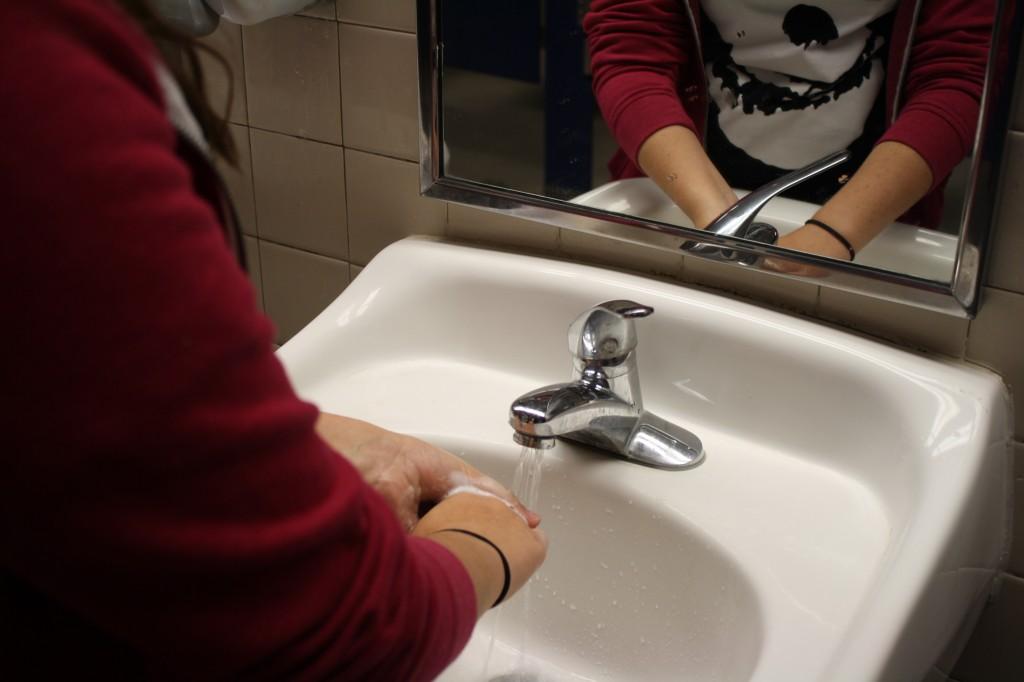 Students practice good hygiene by washing their hands. This keeps germs from spreading and infecting other students. Photo By Hillary Ratcliff