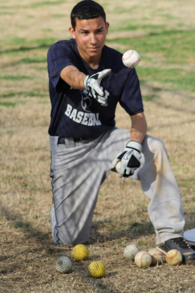 Baseball players practice after school to prepare for their upcoming game. Photo by Andrea Logan