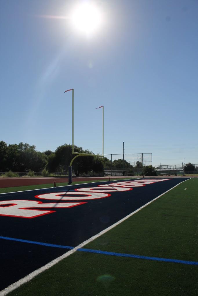 Football teams play on new field