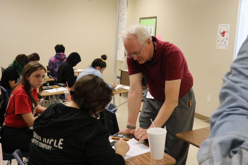 Mr. Thompson helps geometry student Ilyana Hopper with a math problem. 
Photo by 
Gisselle 
Washington.