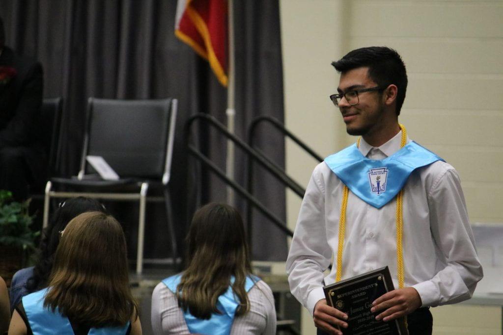 Senior Izac Gonzales receives the Superintendent’s award for his contribution to cancer research. Photo by Ashley Holguin