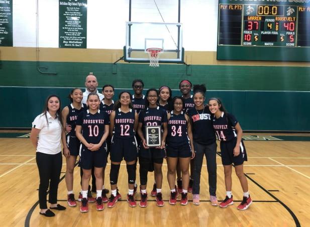 The girls display their plaque after defeating Warren in the championship match. Courtesy Photo. 