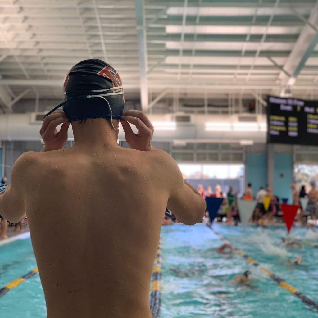 Matthew Swanson preparing to warm up at TISCA preliminaries early on Friday morning.  This was Matthew's second time swimming at TISCA for Roosevelt.