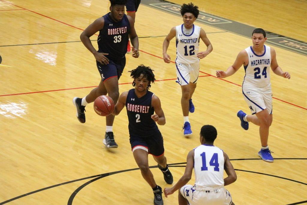 Corey Jackson brings up the ball at the season opener against MacArthur. Photo by Allison Boerger