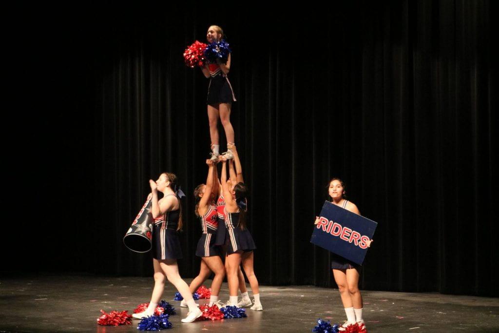 Cheerleaders perform at Teddy Tours. Photo by Destiny Carter