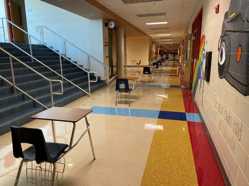 Desks  in the hallways remind students to walk to the right. 